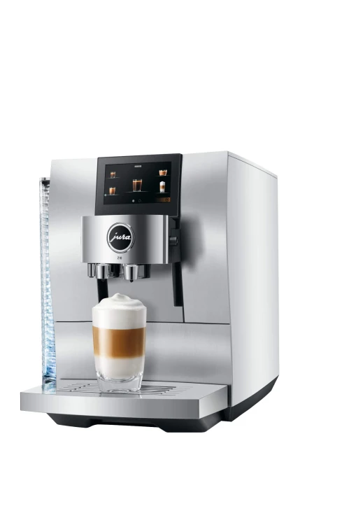 Ekspres Jura Z10 w kolorze Aluminium White, zaprezentowany od prawej strony, ze szklanką kawy Latte Macchiato