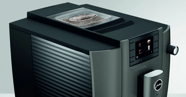 Ekspres Jura E6 EC w kolorze Dark Inox, zbliżenie na panel sterujący z kolorowym wyświetlaczem oraz pokrywę młynka