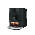 Ekspres Jura ENA 8 EC w kolorze Full Metropolitan Black, zaprezentowany od prawej strony z dwiema kawami espresso, widok na zbiornik wody