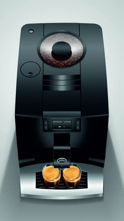 Ekspres Jura C3 EA w kolorze Piano Black, zaprezentowany od góry, z widokiem na zbiornik ziaren kawy, z dwiema szklankami espresso